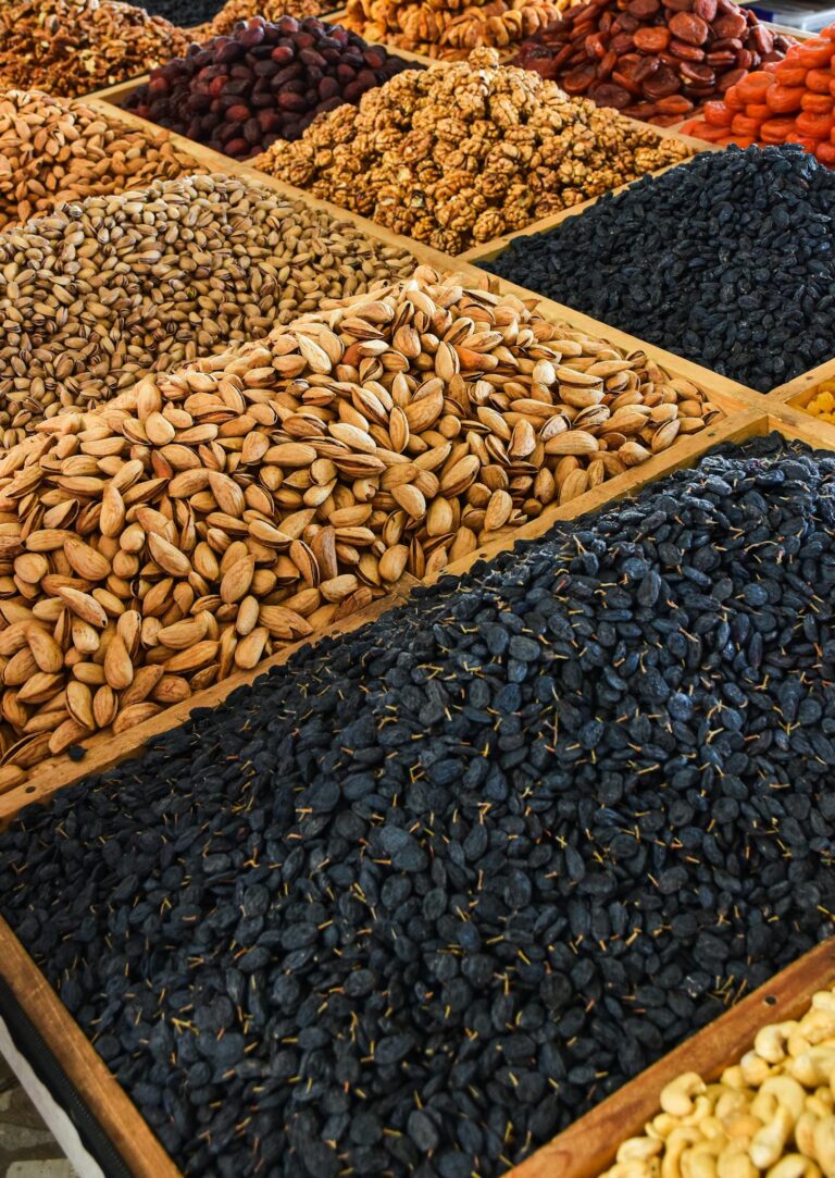 Variety of nuts and seeds displayed at a market. Ideal for culinary and health themes.